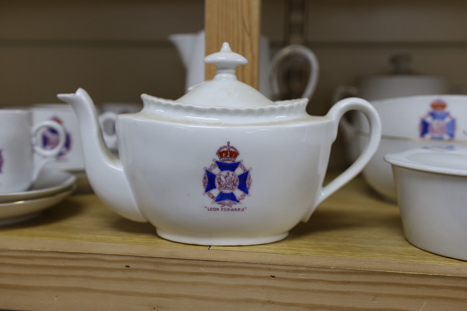 Society of Miniature Rifle Clubs - A large group of commemorative porcelain tea wares, three handled tygs and plates awarded for skill in rifle shooting, early 20th century